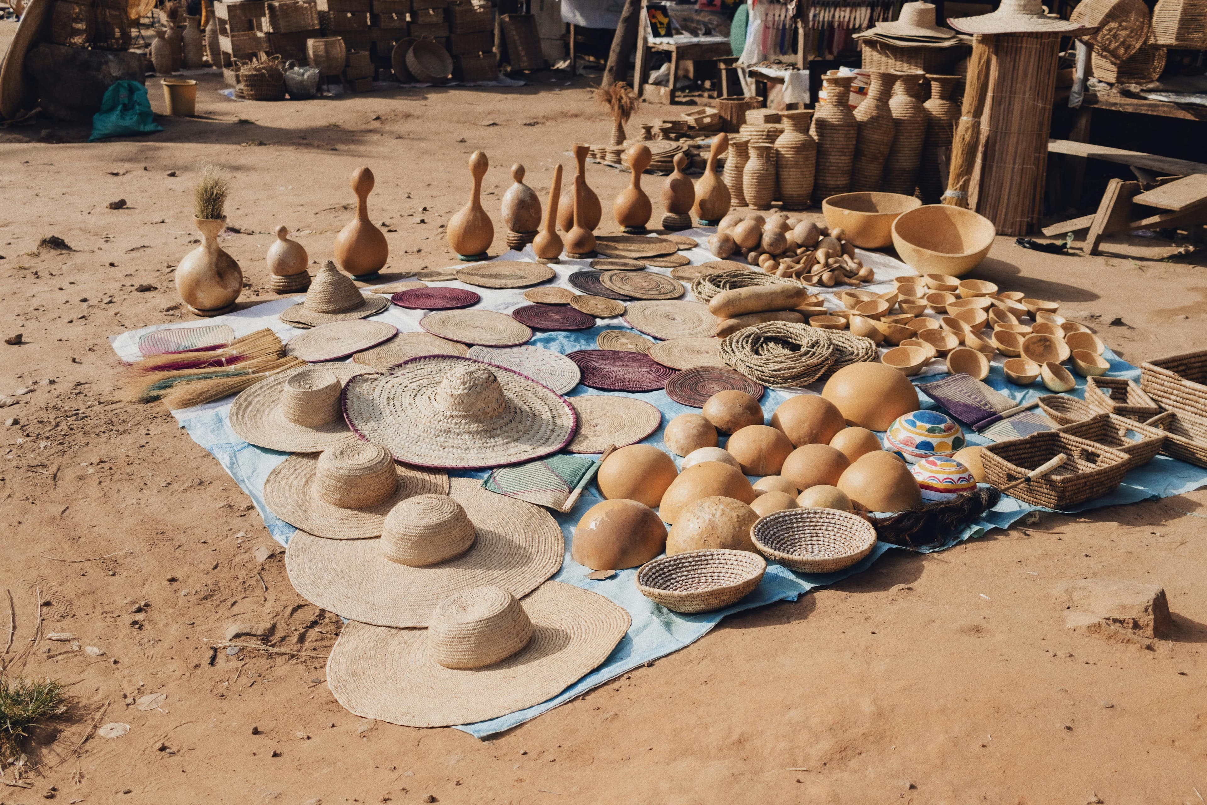 African and Caribbean Heritage Food Network craft market display with woven hats, bowls, and hand-shaped vessels representing cultural heritage